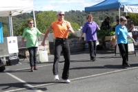 Caro, from ’Bootscootn Basics’ in Diamond Creek, led her group of country line dancers.