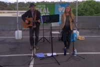 Johnny Cronin and Yani sing folk music.